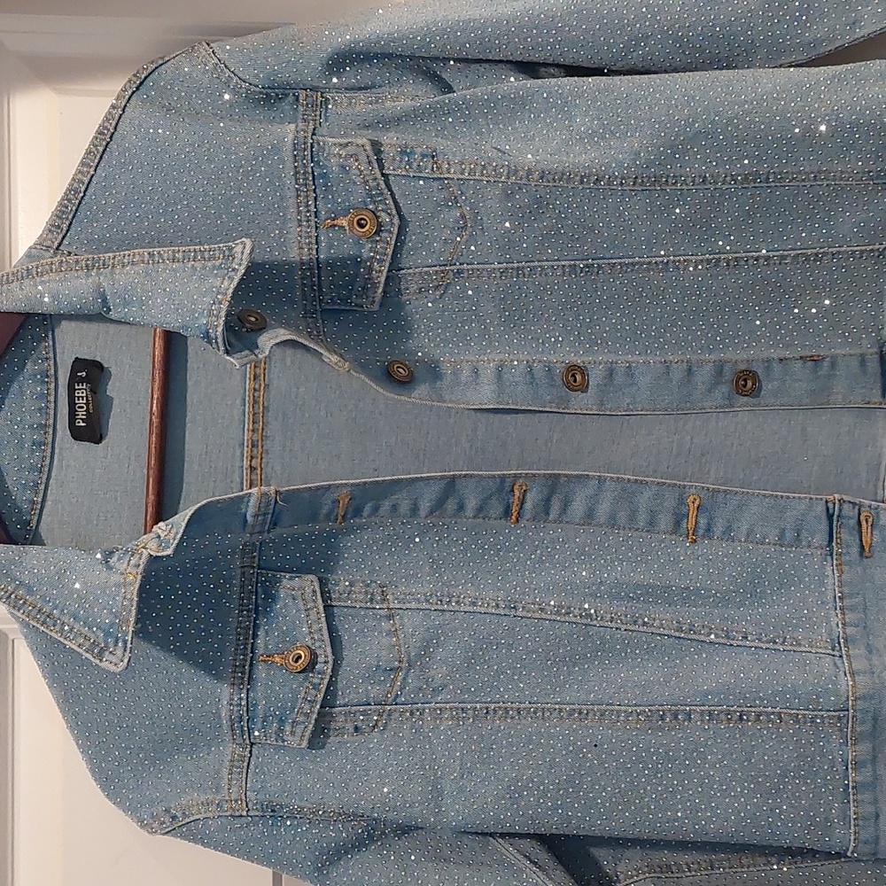 Woman never worn New blue jean sparkle jacket. You'll love it